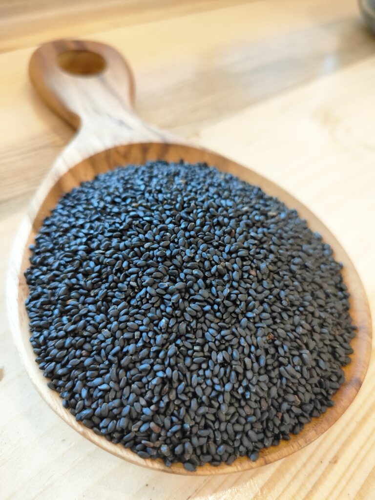 Basil Seeds on a wooden spoon