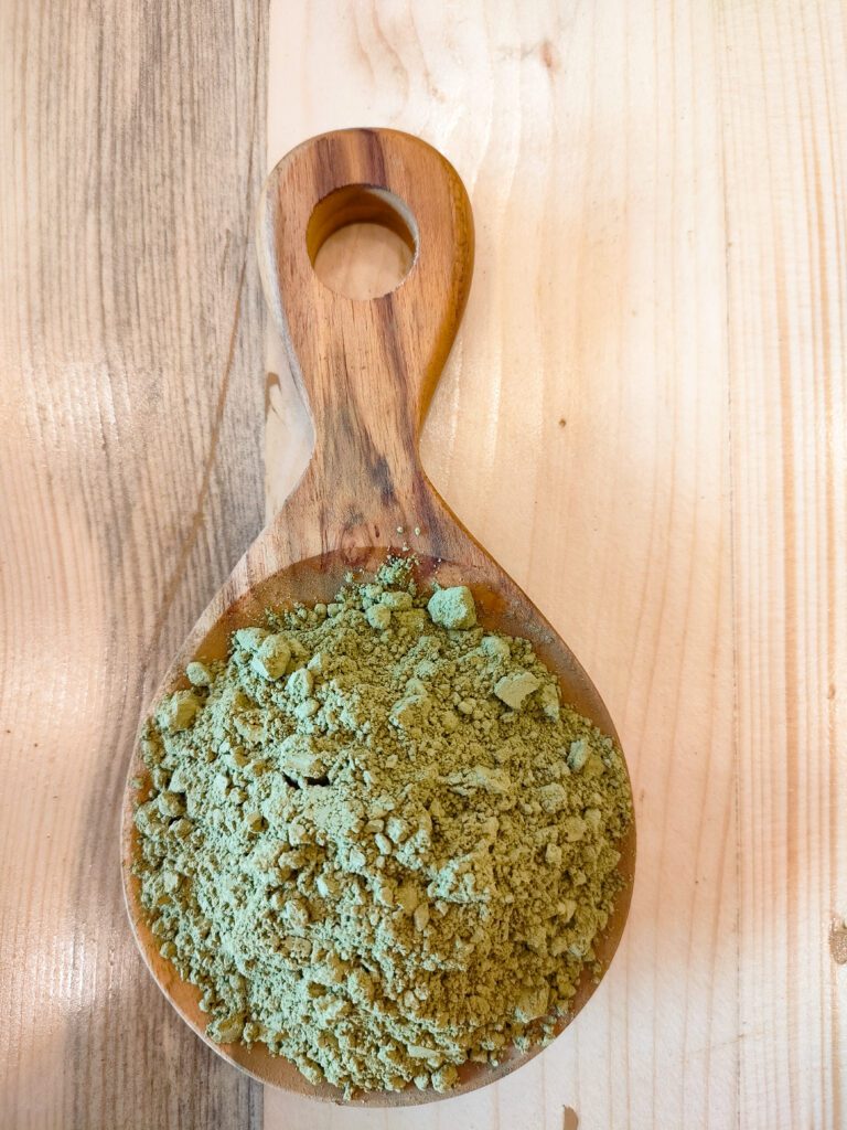 Maeng Da Kratom powder on a wooden spoon