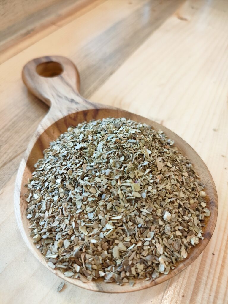 Oregano on a wooden spoon