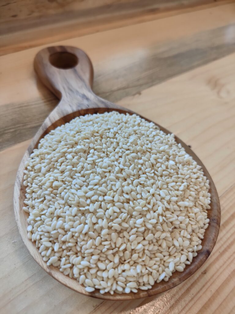 Sesame Seeds on a wooden spoon